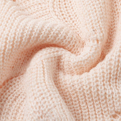 Gros plan de la maille côtelée rose pâle